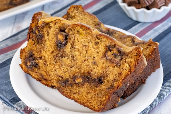 Two slices of peanut butter cup banana bread on a white plate