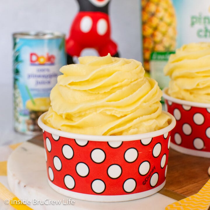 A red and white cup filled with a homemade dole whip swirl.