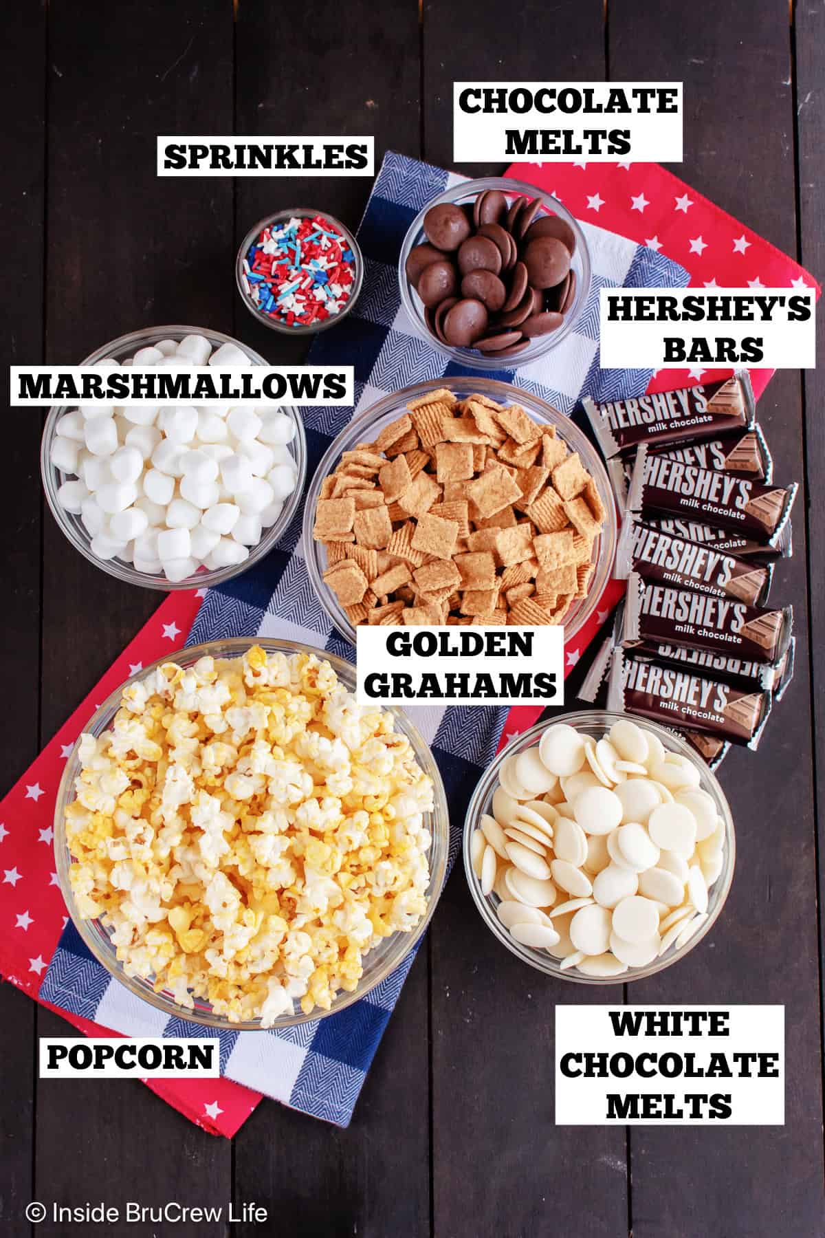 Ingredients for s'mores popcorn mix with text labels.