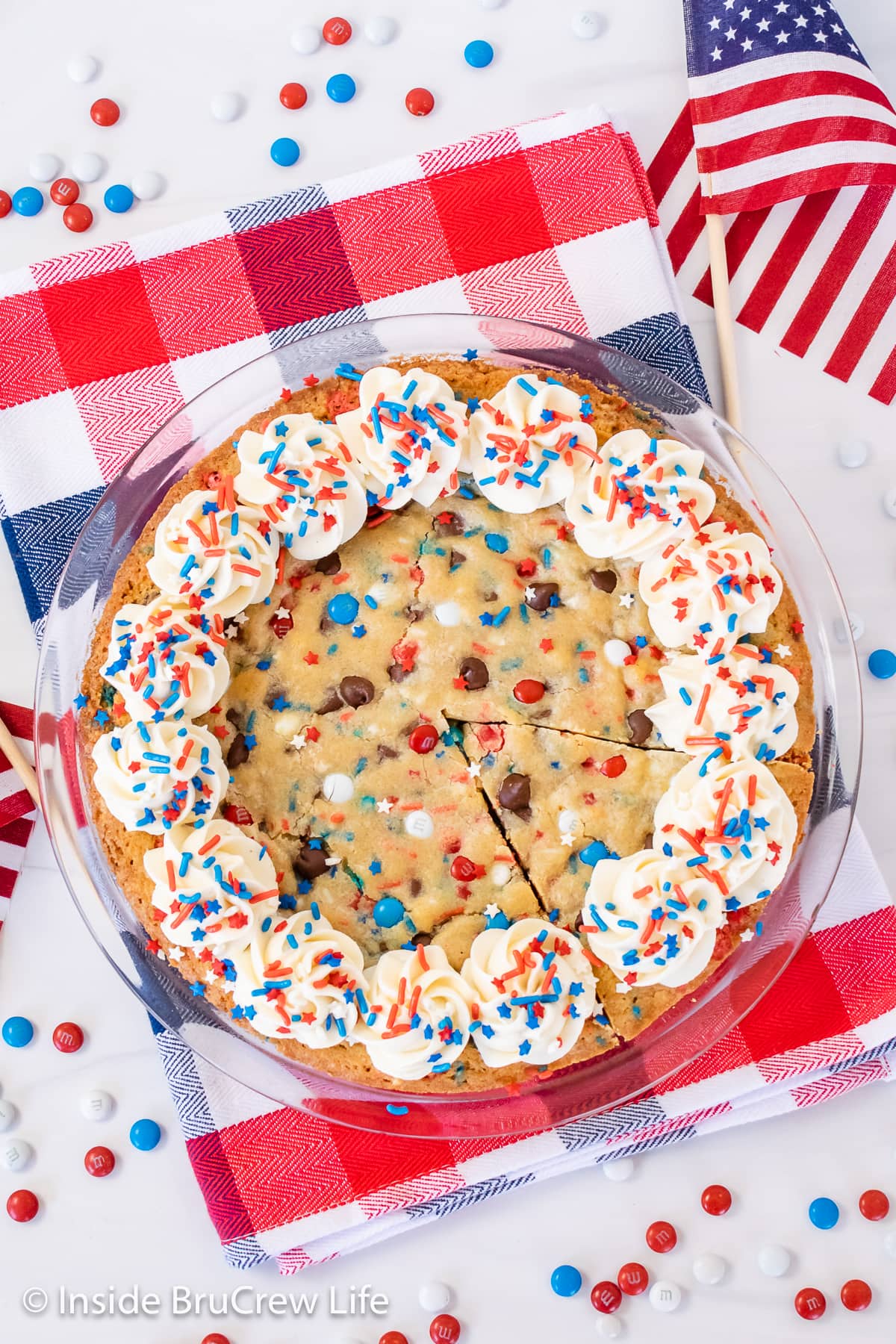 Overhead picture of a red white and blue cookie cake.