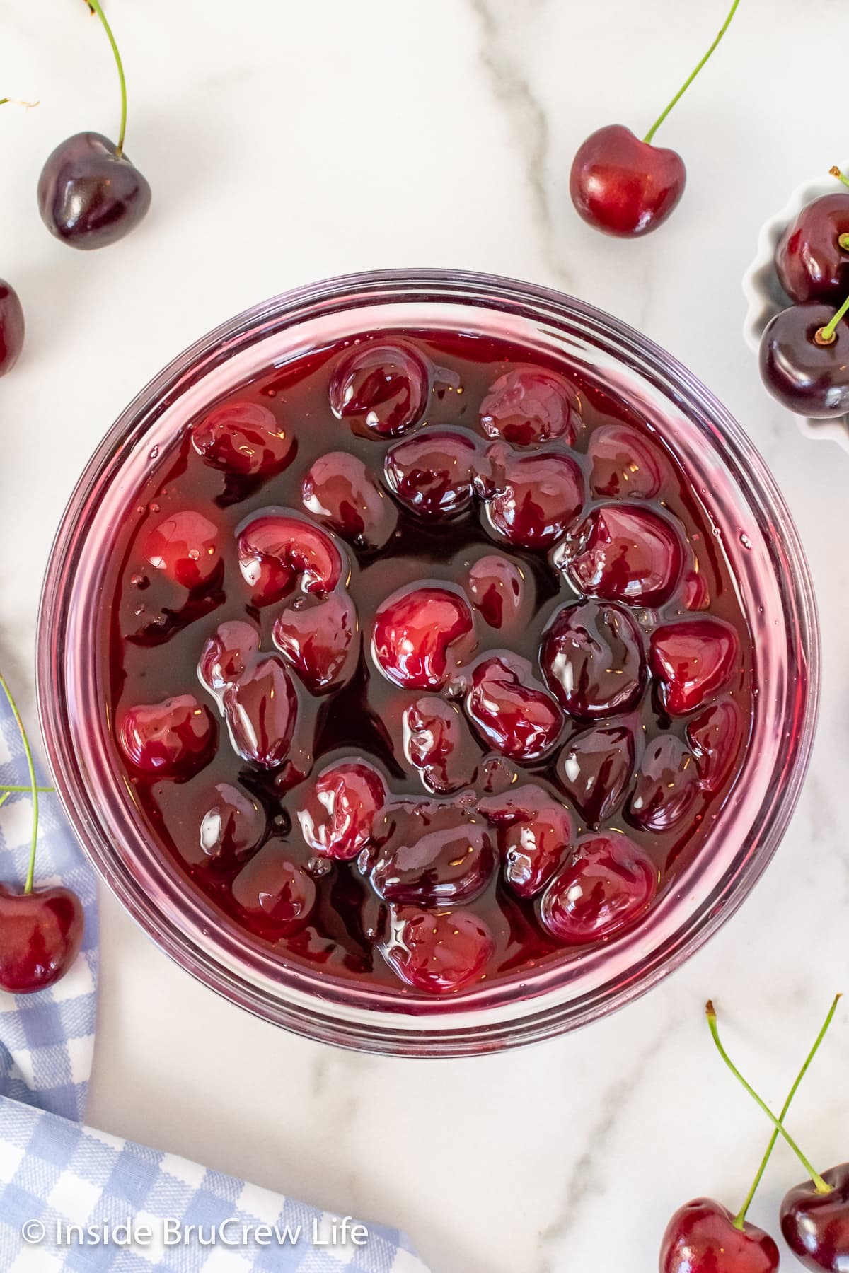 A bowl filled with cherry pie filling.