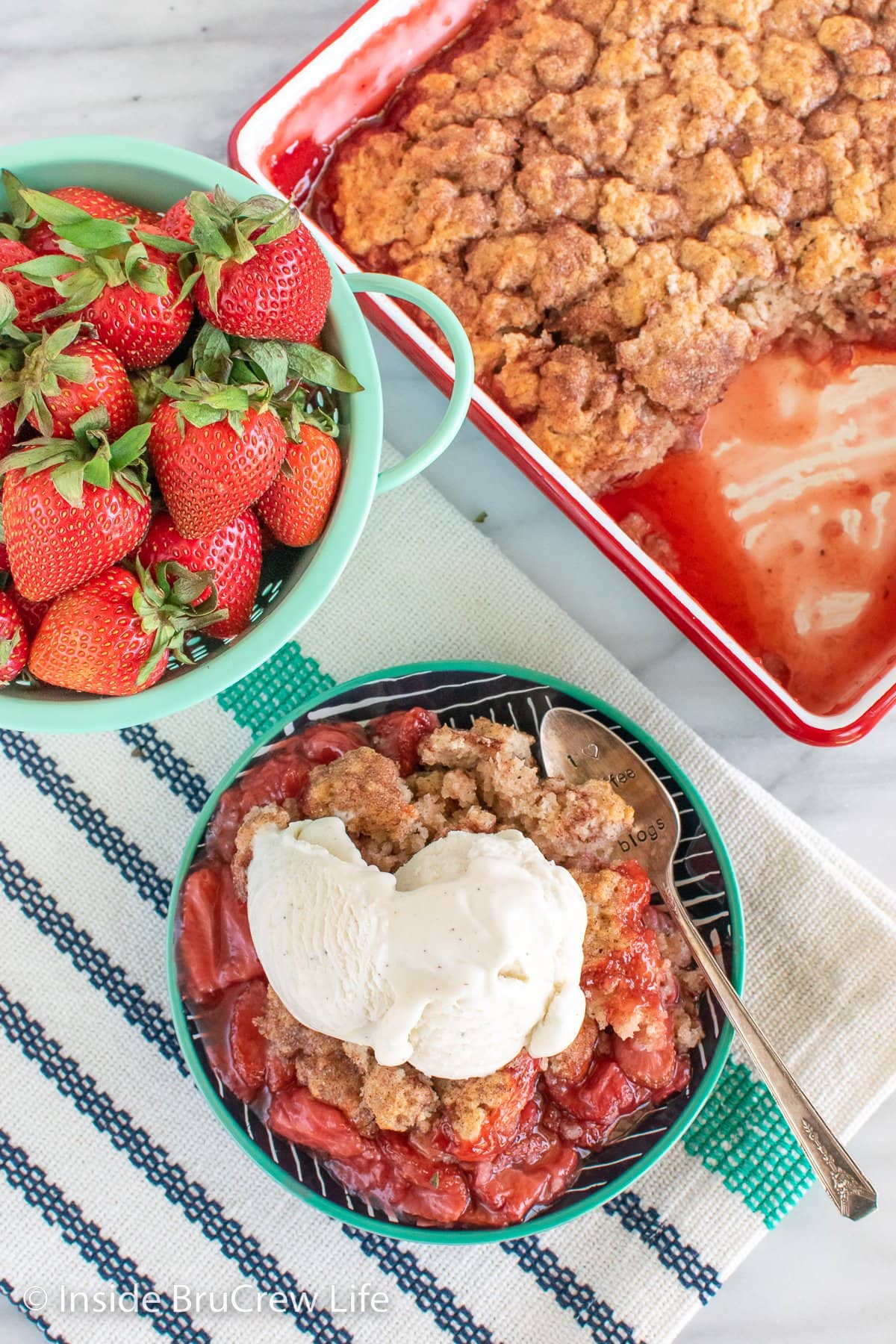 Overhead picture of a plate with strawberry cobbler on it.