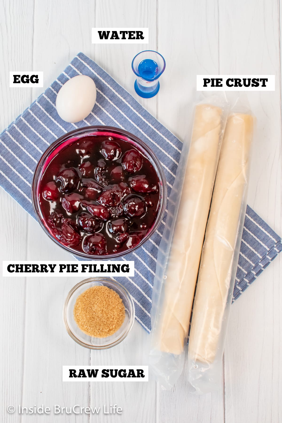 A white board with ingredients needed to make a homemade cherry pie.