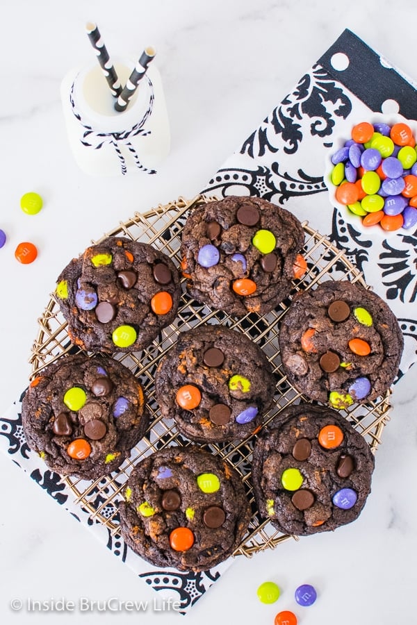 Overhead picture of a tray of Halloween chocolate cookies and cream cookies on a white background