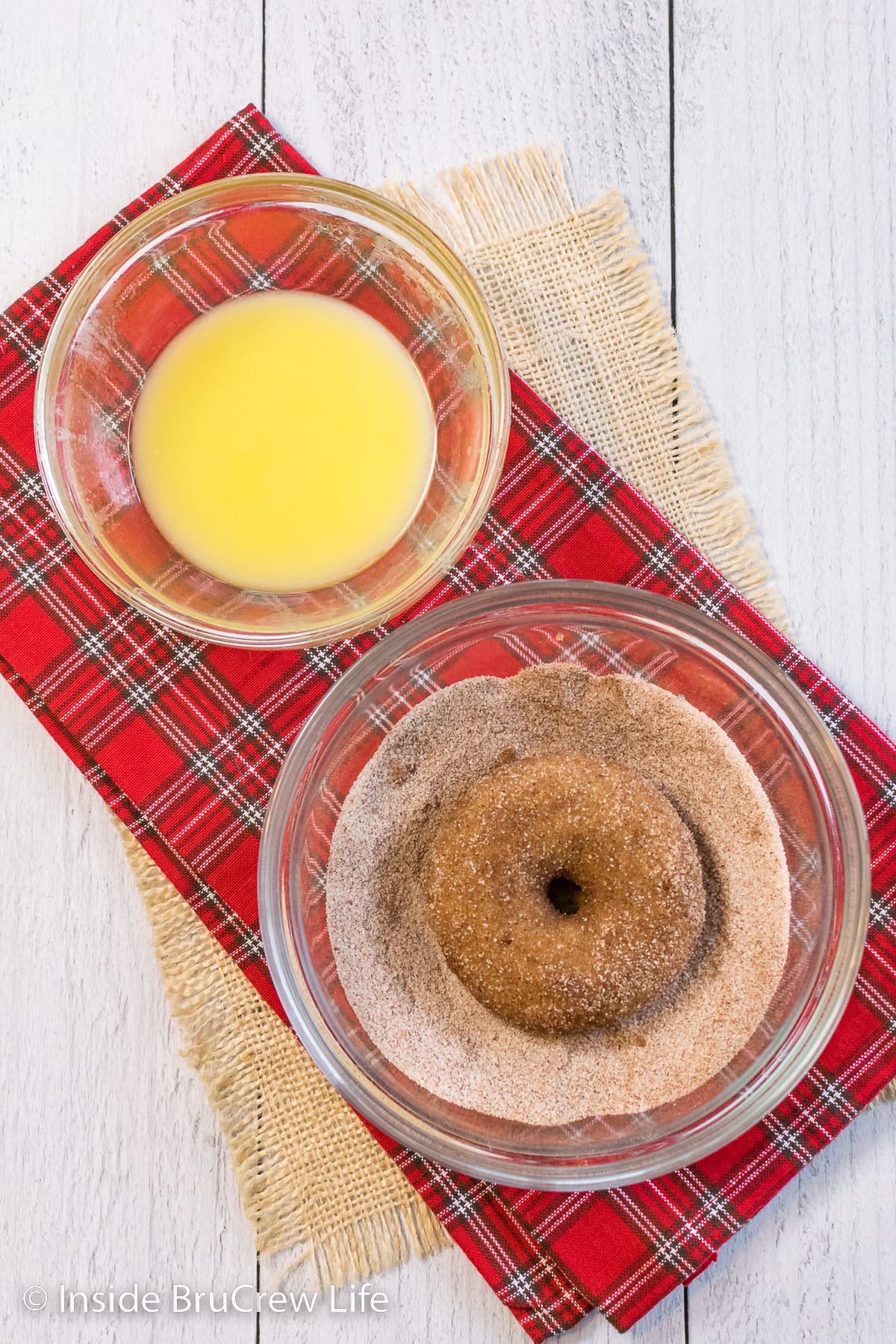 Butter and cinnamon sugar in a bowls to roll donuts in.