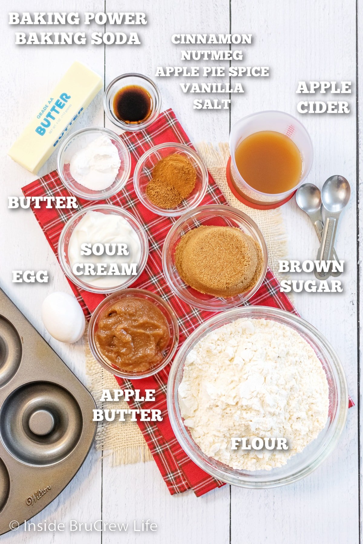 A white board with ingredients on it to make baked donuts.