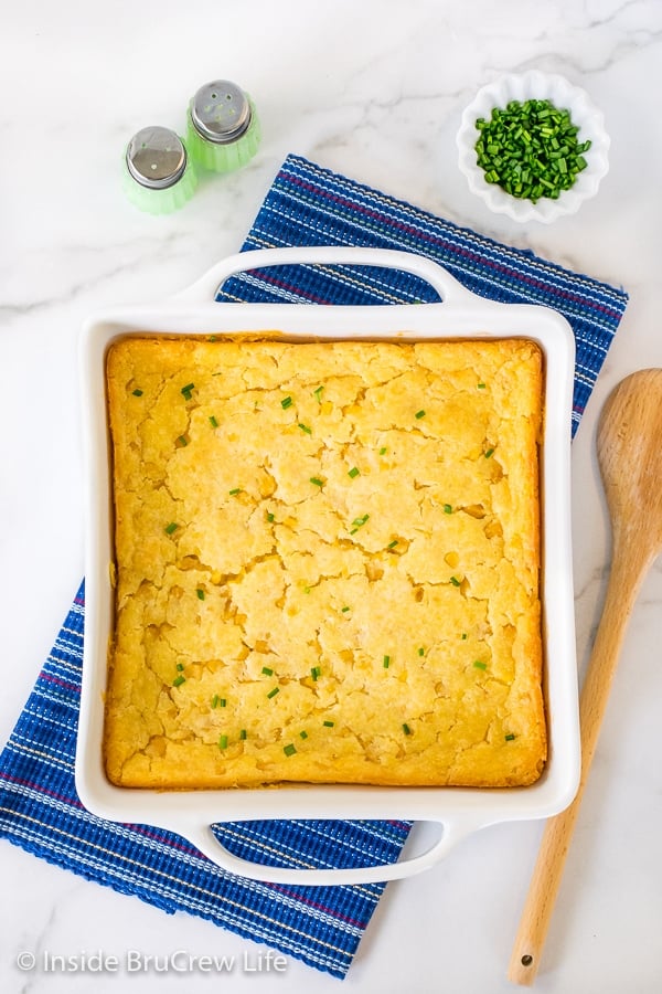 Overhead picture of a white casserole dish with baked jiffy corn casserole in it.