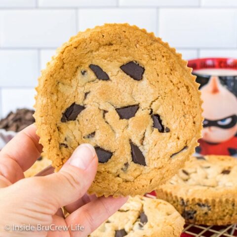 A giant Jack Jack Num Num Cookie held up in front of a white background