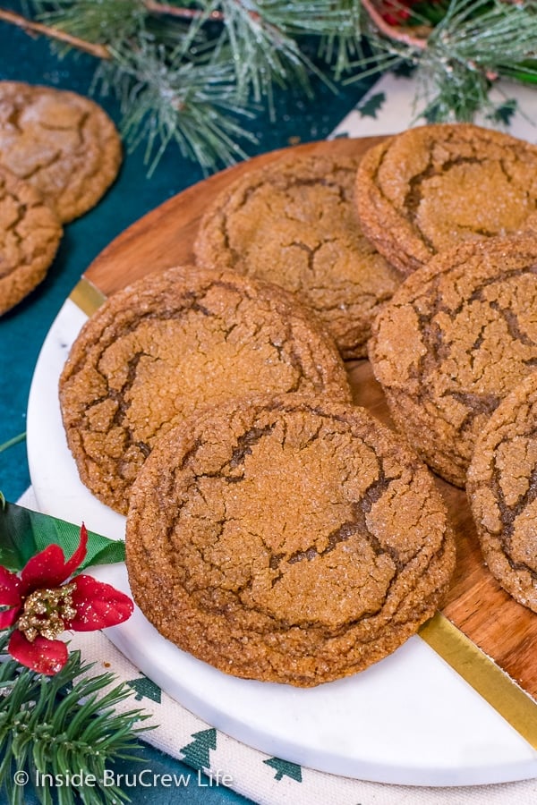 A tray with Molasses Crackle Cookies stacked on it