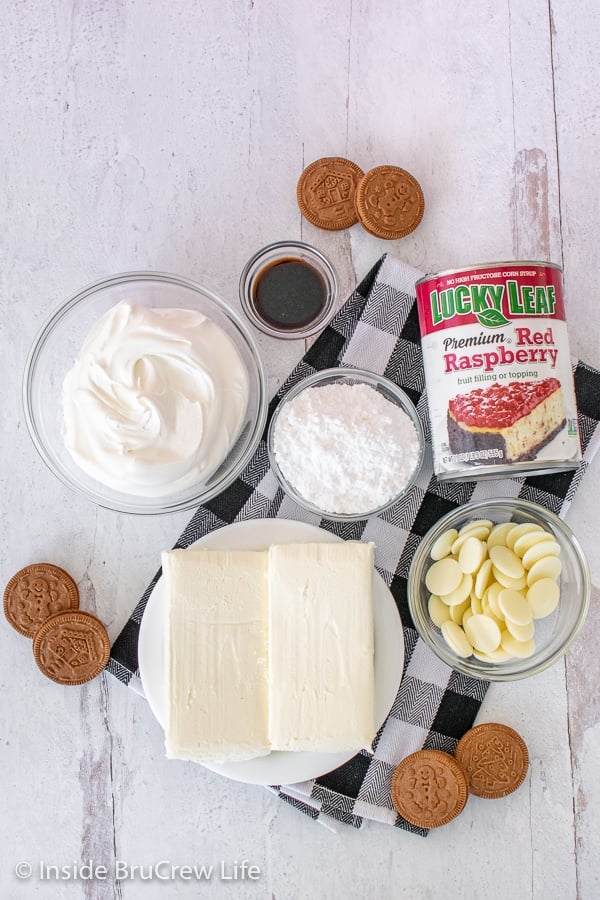 Overhead picture of ingredients needed to make raspberry white chocolate cheesecake parfaits