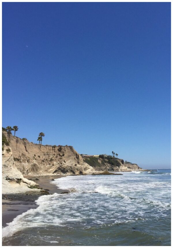 Tide water rolling onto the sand at Pismo Beach California