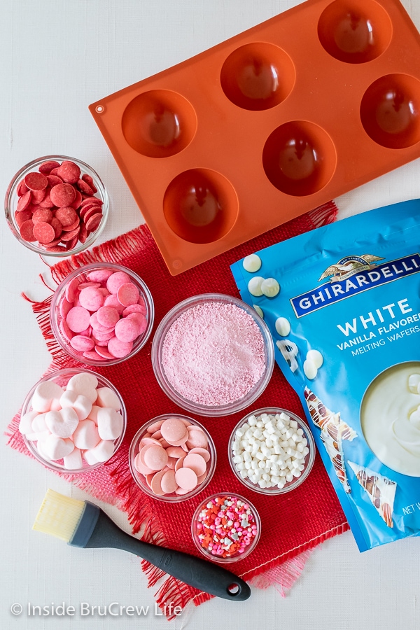 Overhead picture of the ingredients needed to make strawberry white hot chocolate bombs