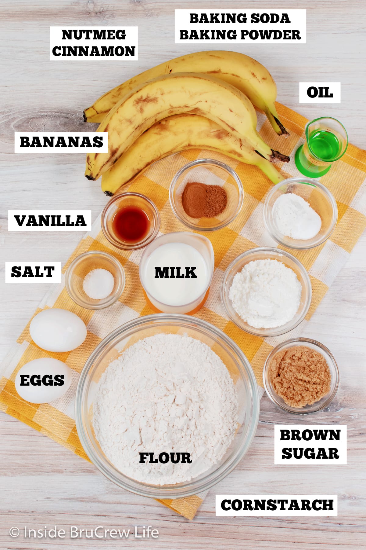 Bowls of ingredients needed to make banana waffles.