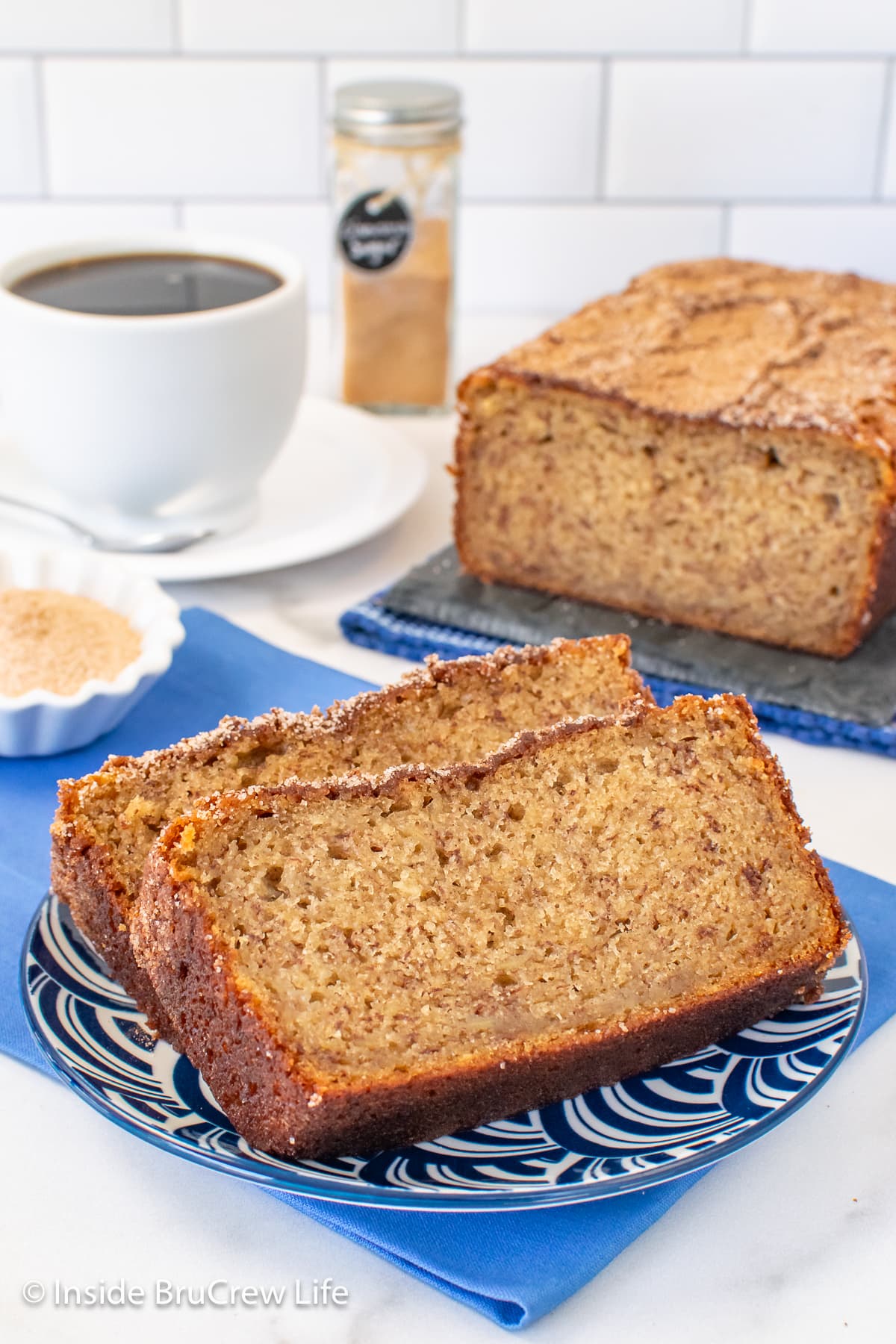 Two slices of sweet bread on a blue plate.