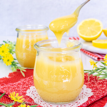 A clear jar filled with homemade lemon curd and a spoon lifting some out