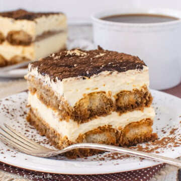 A white plate with a layered no bake coffee dessert on it.