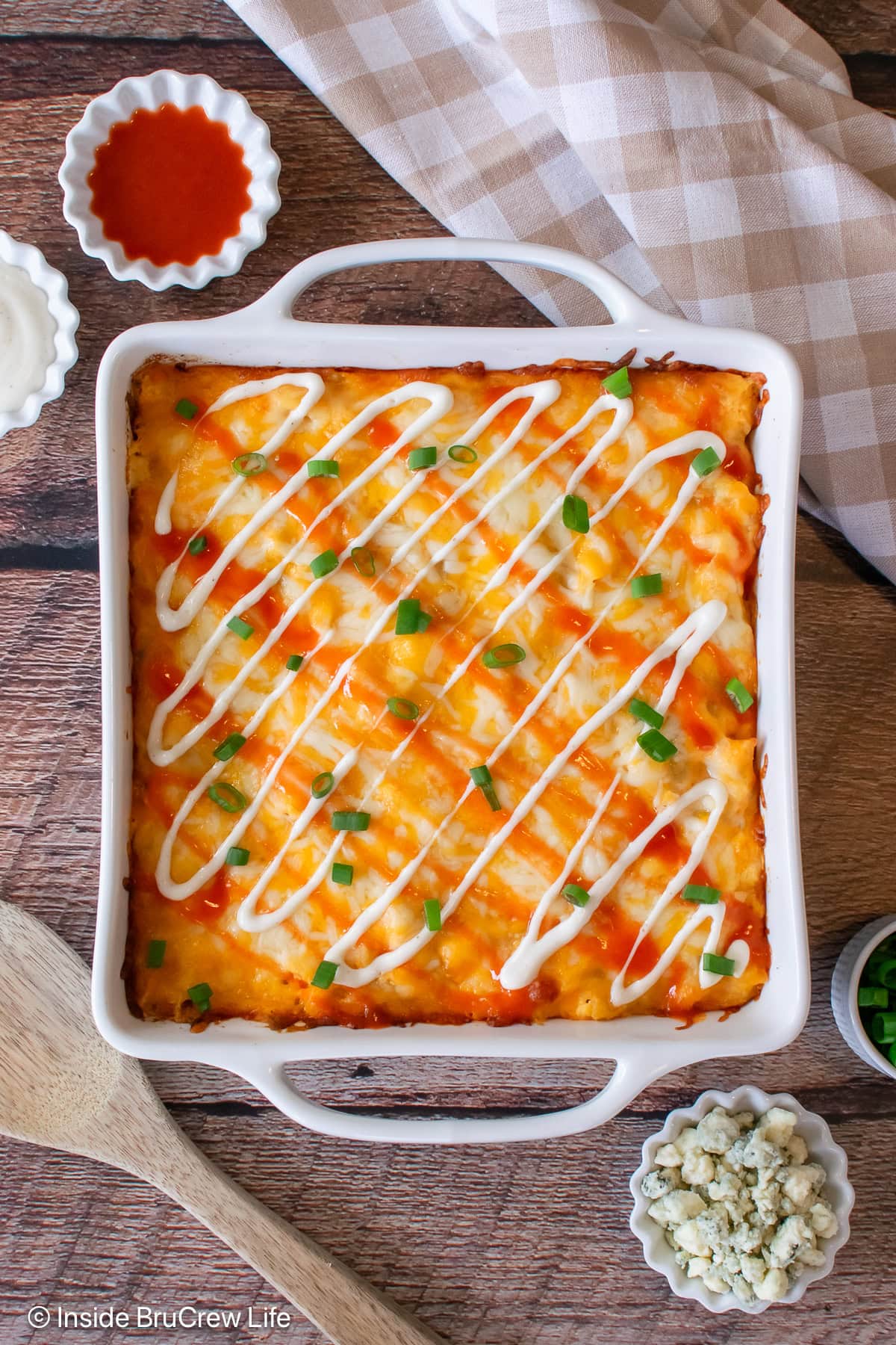 A white casserole dish filled with cheesy pasta.