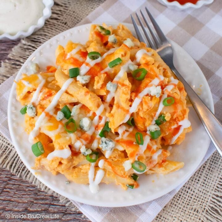 A serving of buffalo chicken pasta on a white plate.