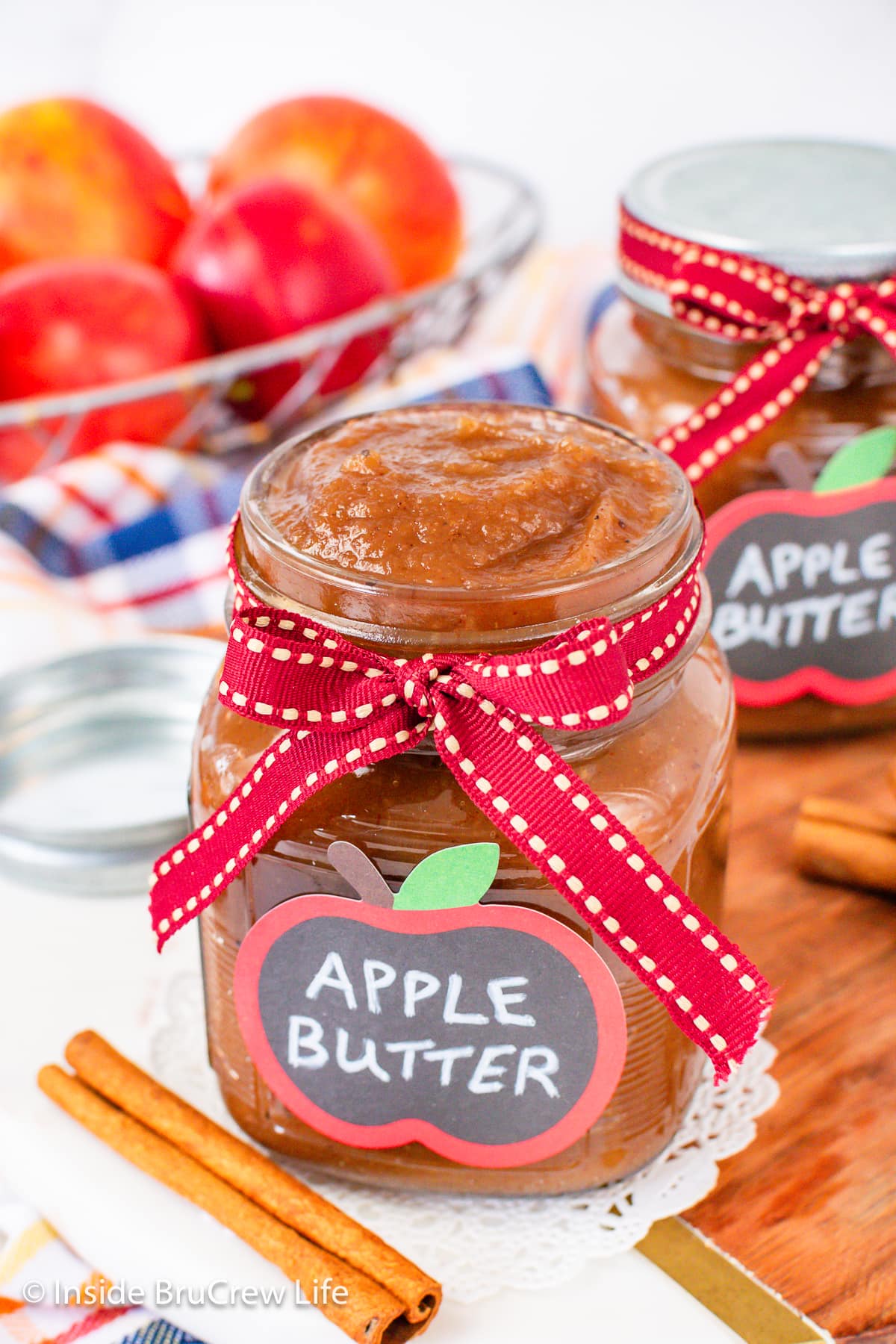 A jar filled with apple butter and tied with a ribbon.