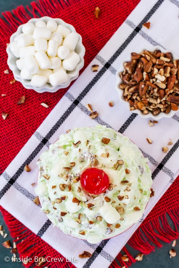 An overhead picture of a bowl filled with pistachio pudding dessert.