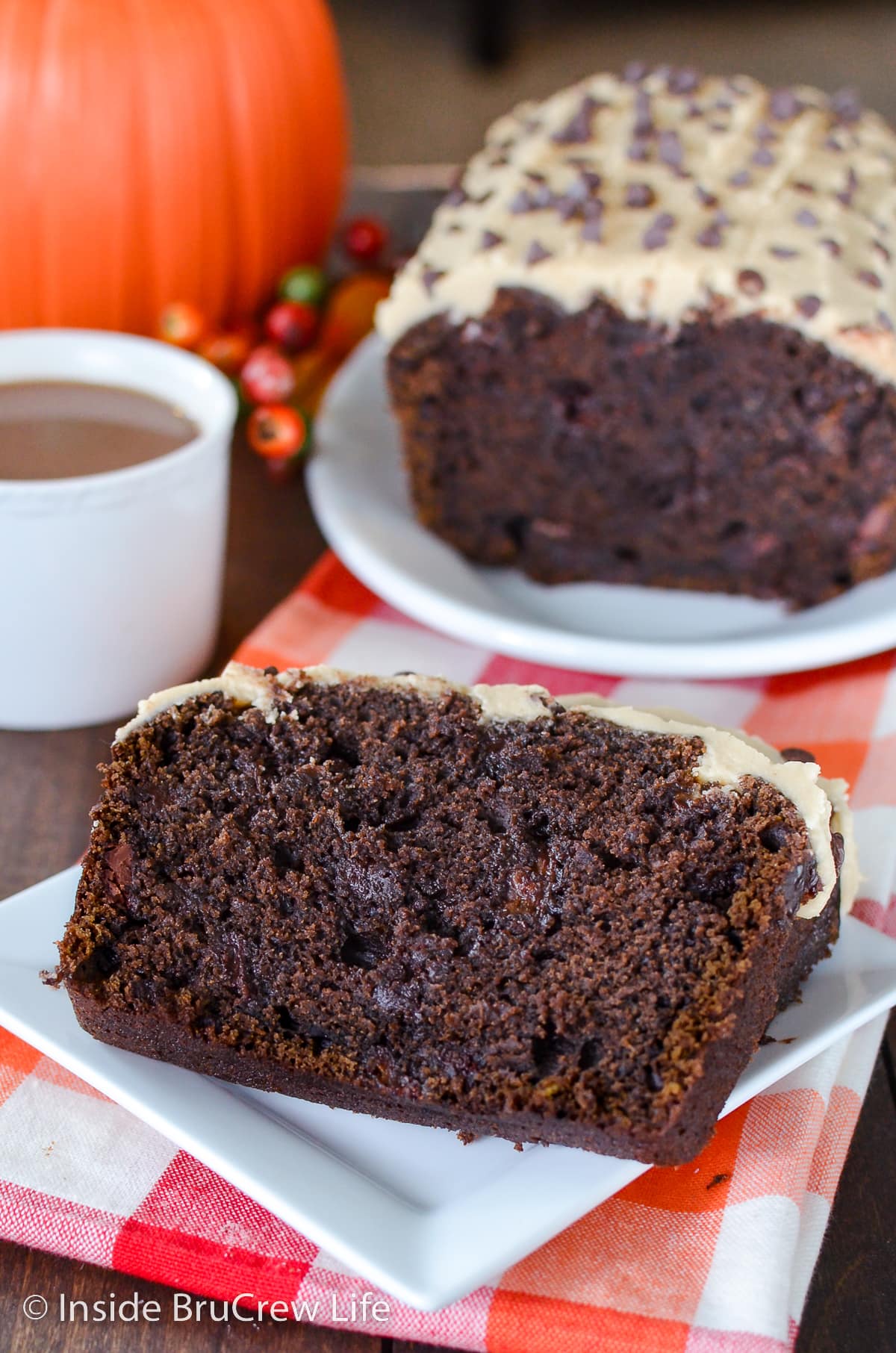 A slice of chocolate sweet bread on a white plate.