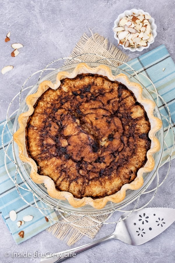 A blue board with an overhead picture of a funny cake pie.