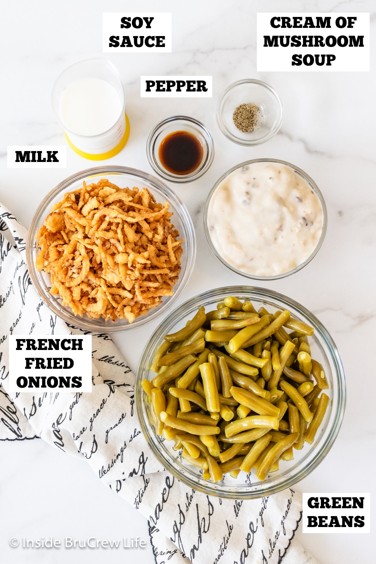 A white board with bowls of ingredients.