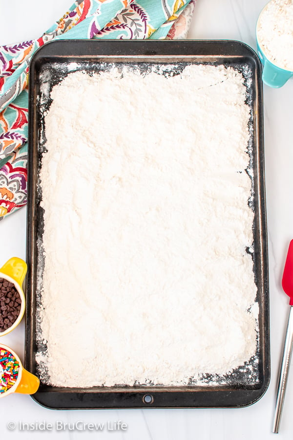 A sheet pan with flour on it.