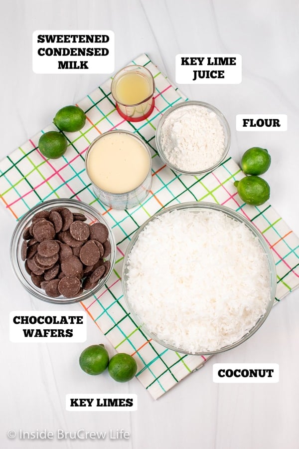 A white board with bowls of ingredients for coconut macaroons.