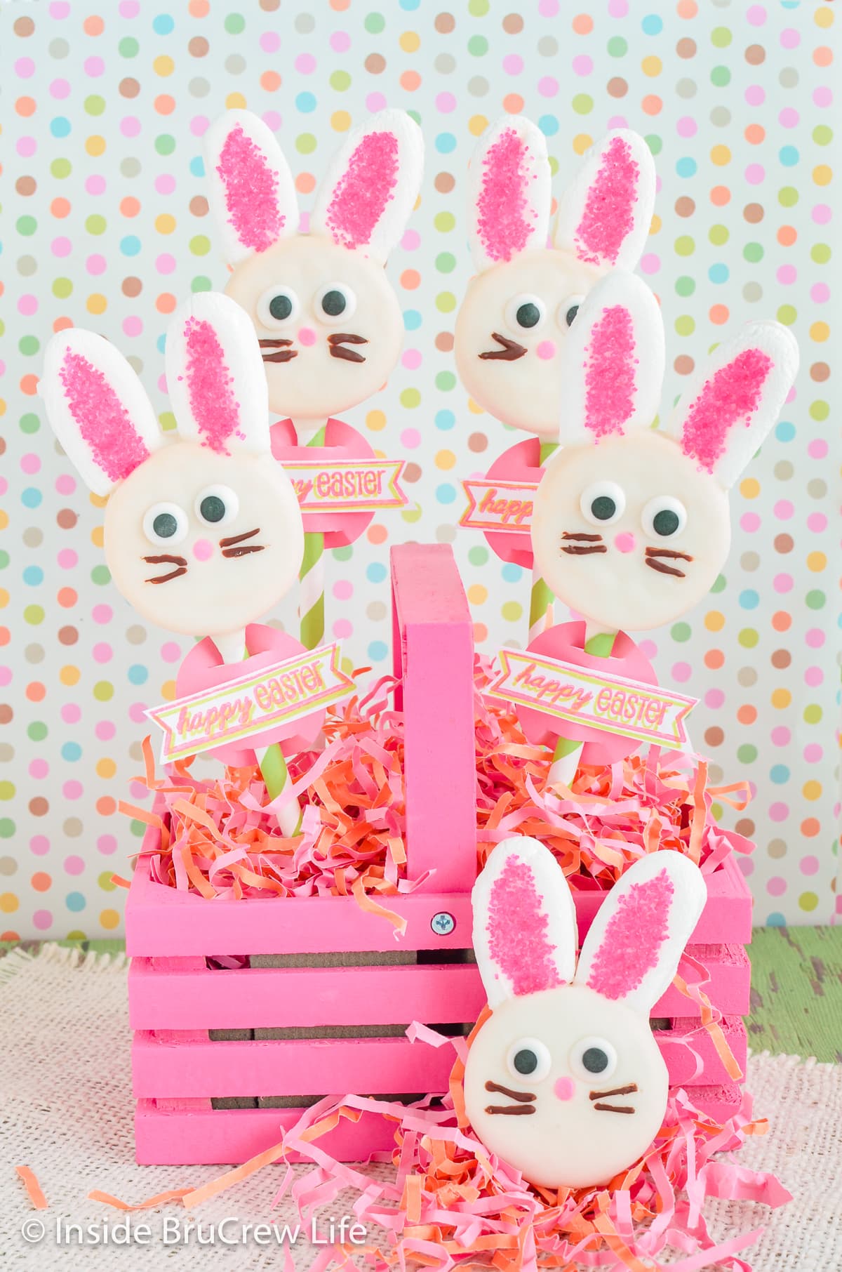 Pink basket with Oreo bunny pops stuck in it.