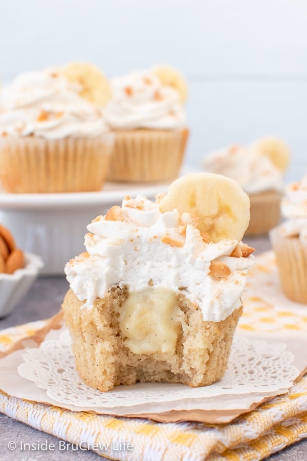 A pudding filled cupcake with a bite taken out of it.