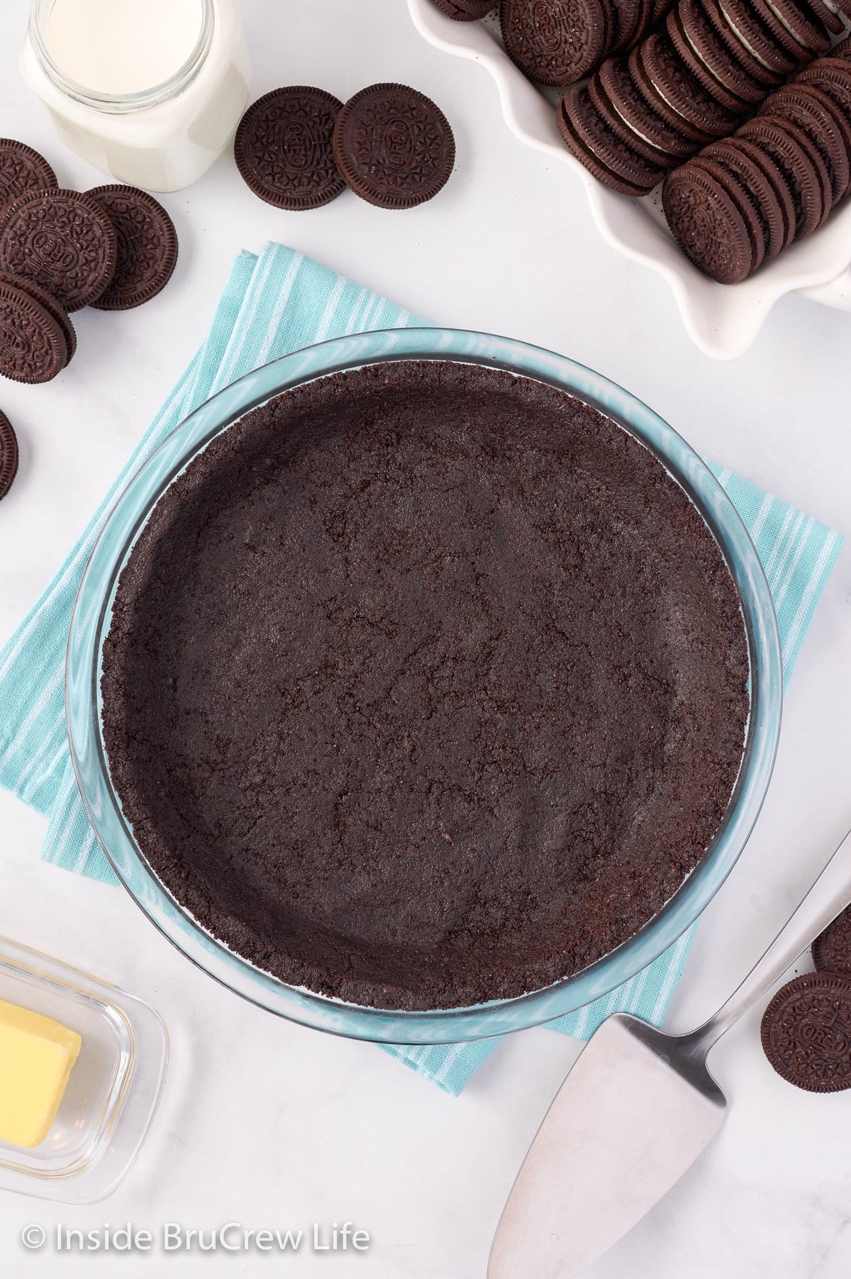 Overhead picture of an Oreo crust on a white board.