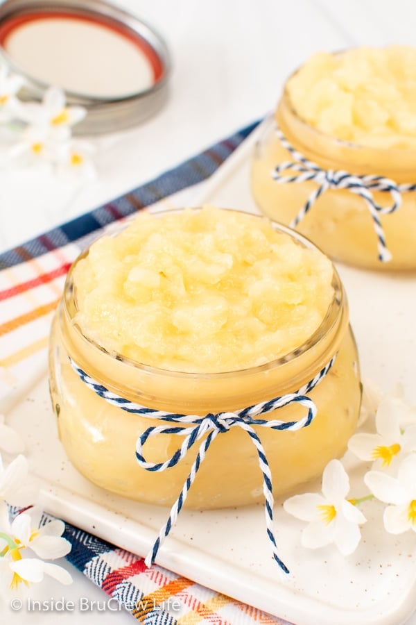 2 clear jars filled with pineapple pie filling.