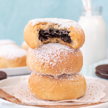 Three fried Oreos stacked on a plate.