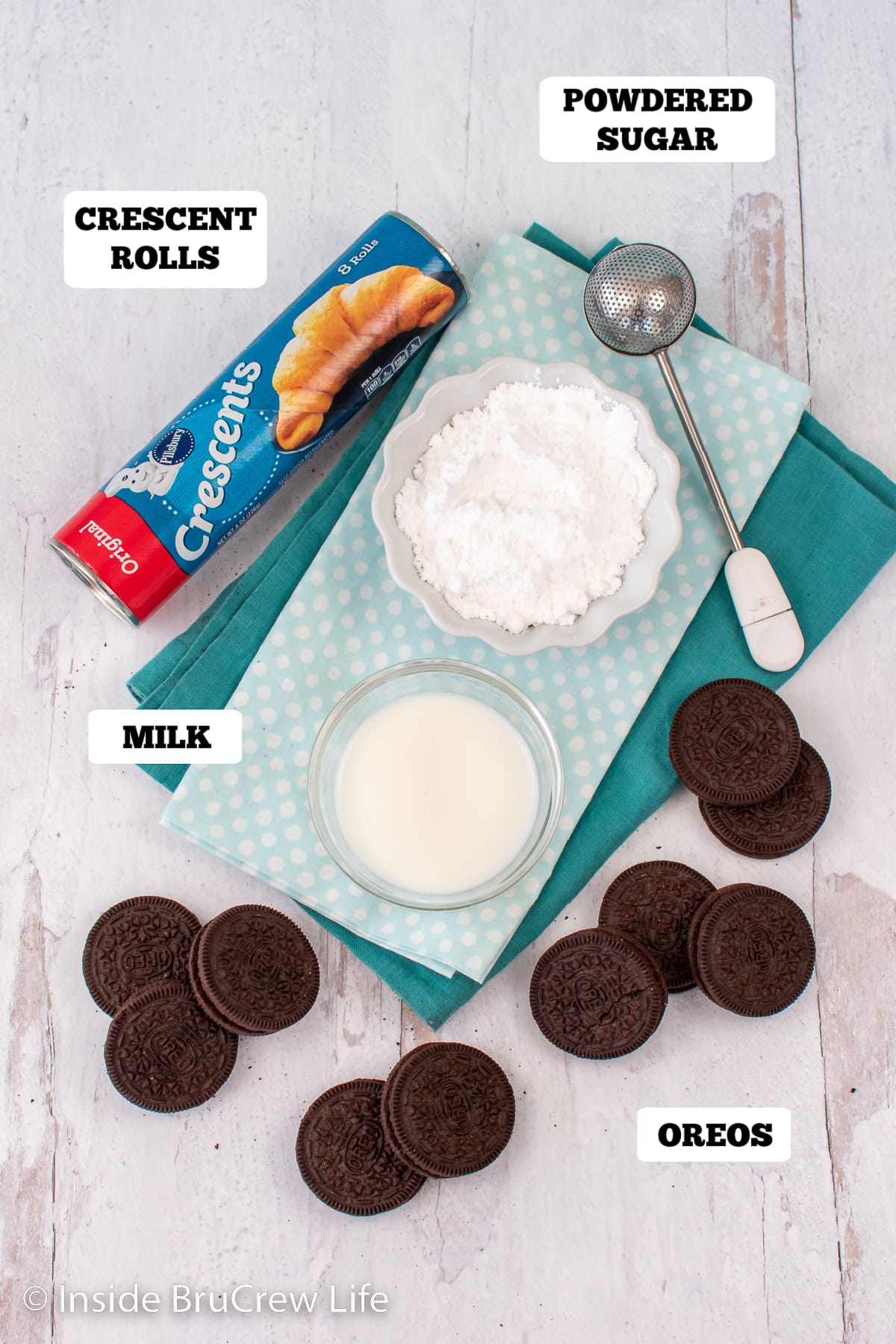 A white board with ingredients to make crescent rolls stuffed cookies.