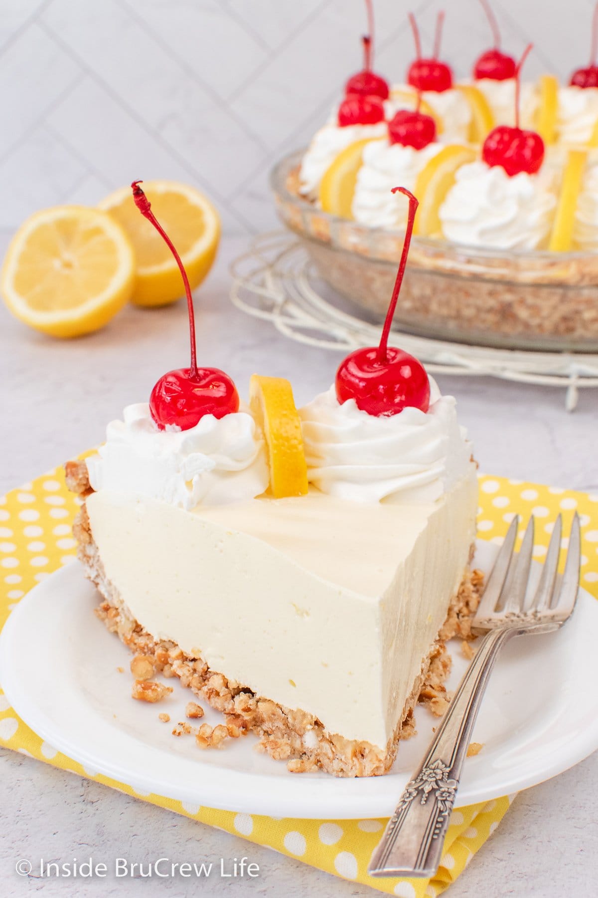 Lemon Jello pie slice on a white plate.