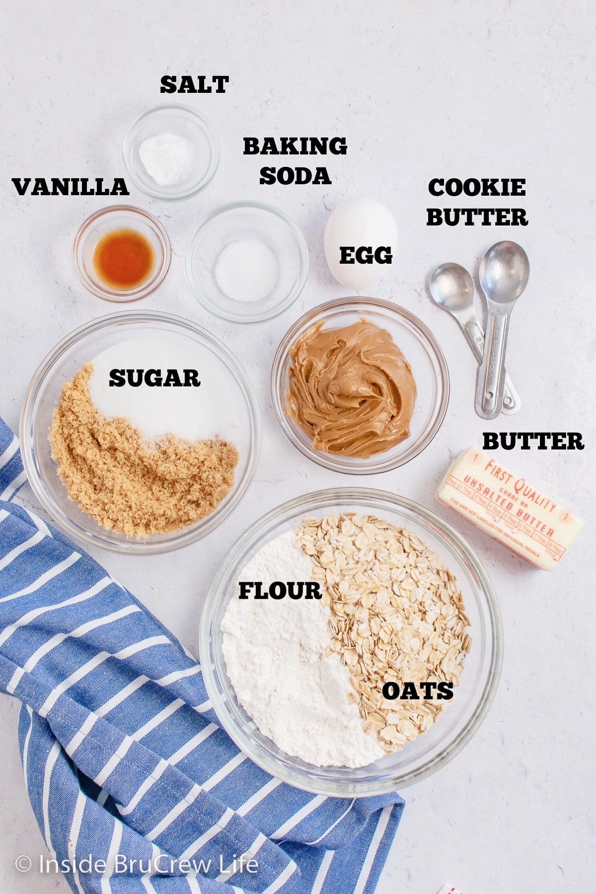 Bowls filled with ingredients to make oatmeal bars.