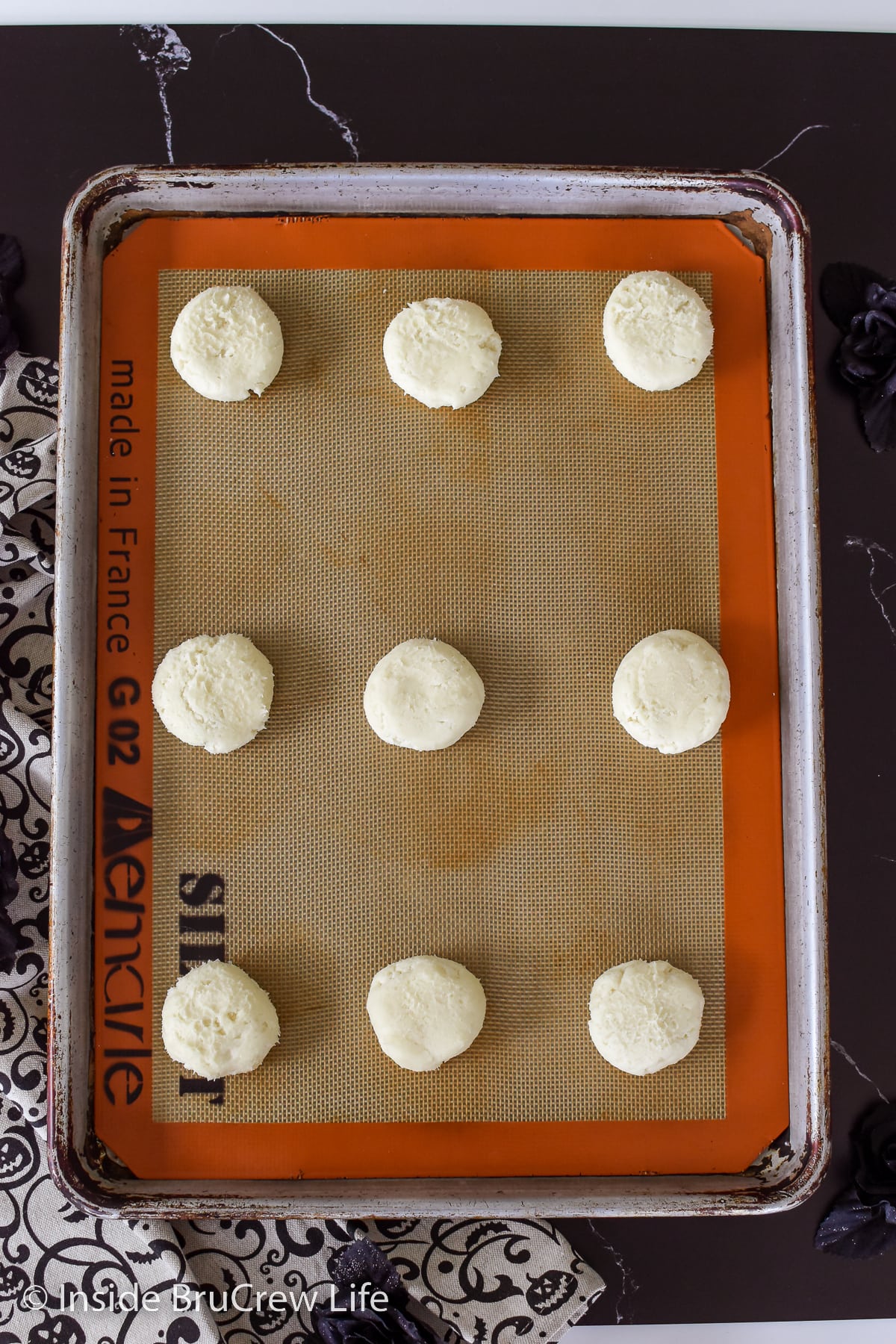 Cookie dough on a baking sheet.