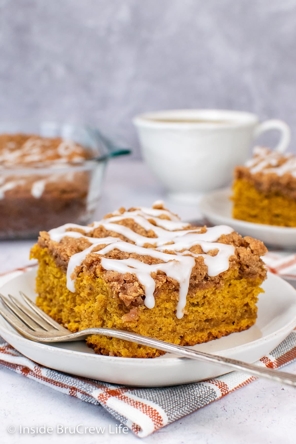 A slice of pumpkin coffee cake topped 