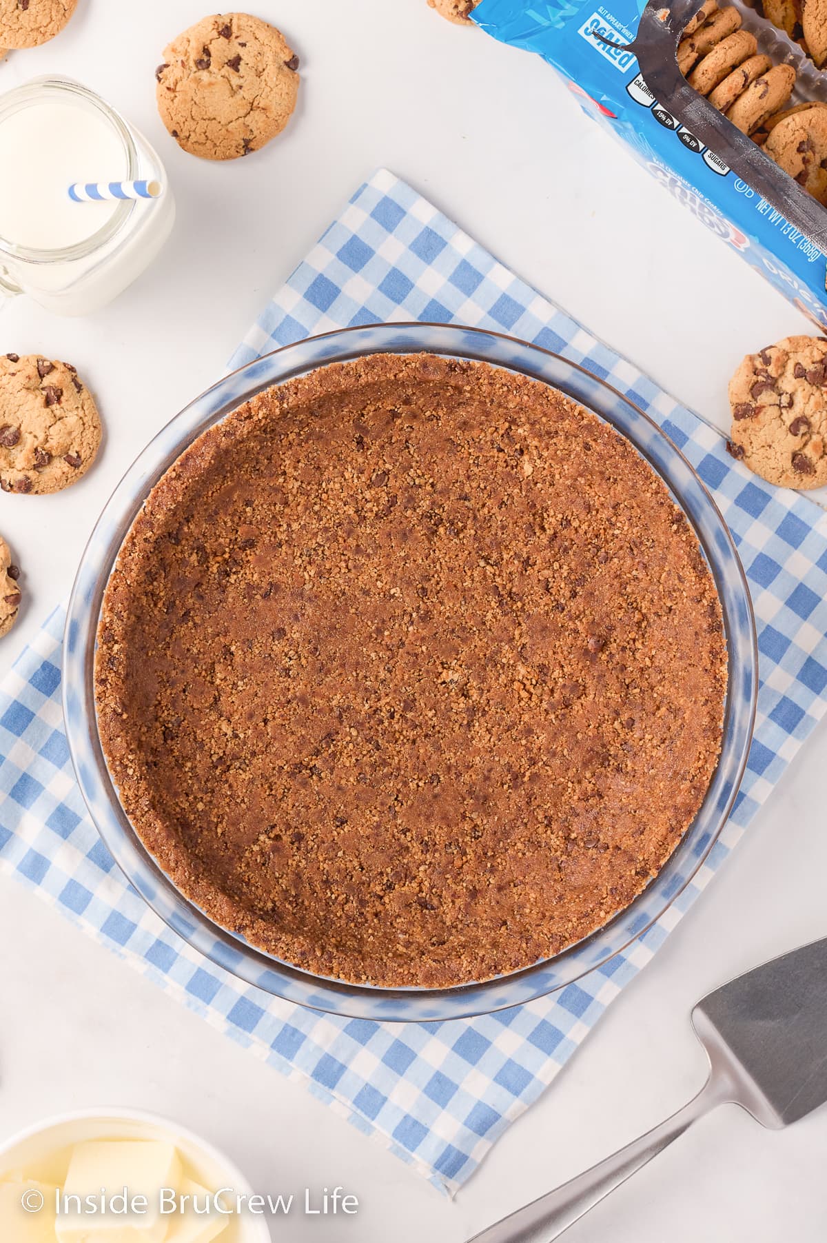 A cookie crust on a blue and white towel.