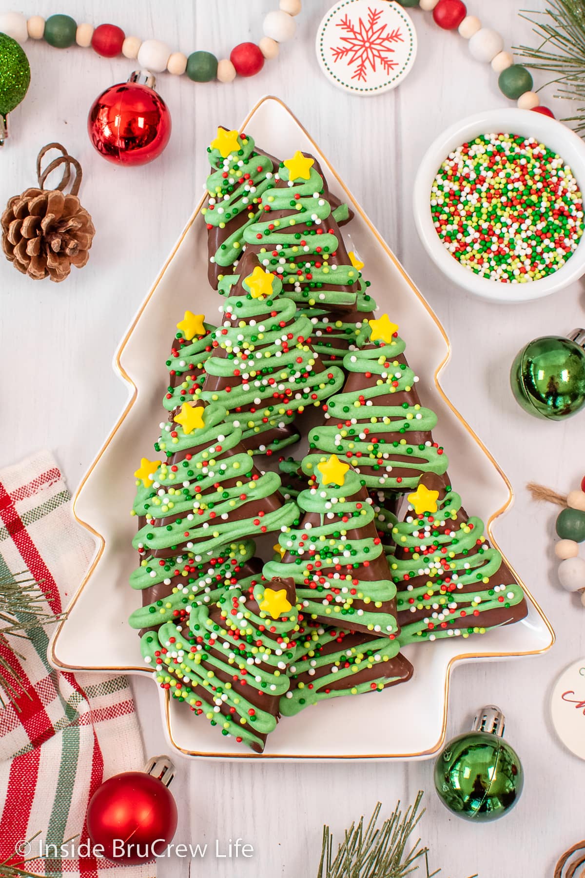 A white board with a plate filled with Reese's peanut butter trees.