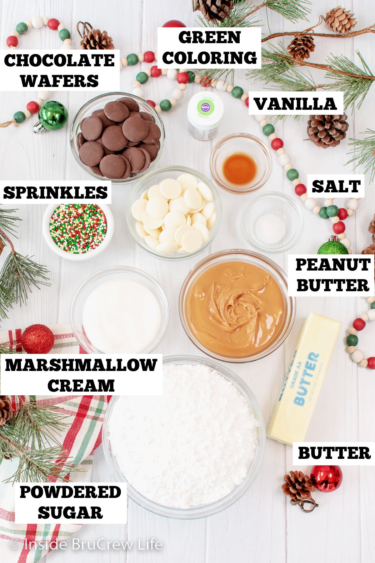 A white board with bowls of ingredients for Reese's trees.