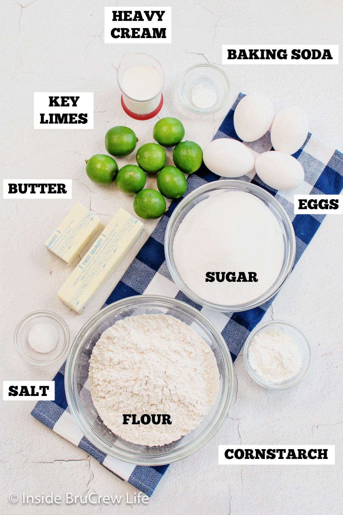 Bowls of ingredients needed to make a citrus cake.