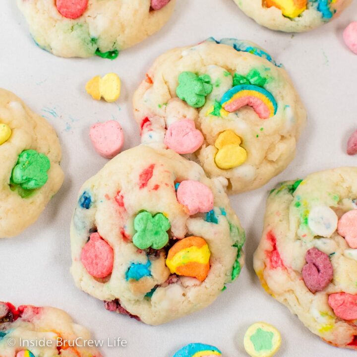 A white board with Lucky Charms cookies lying on it.
