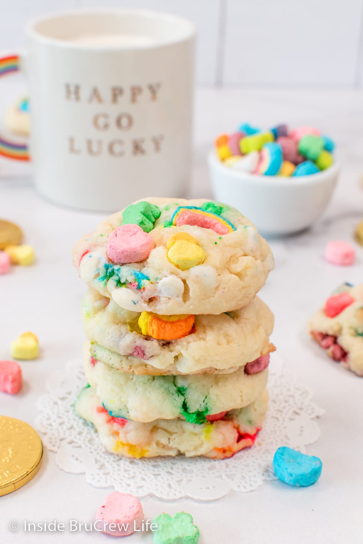 A stack of marshmallow cake mix cookies on a white board.