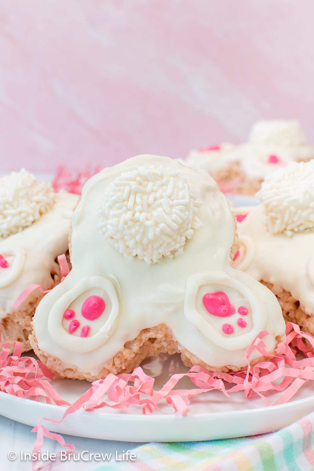 Bunny rice krispie treats decorated with white chocolate so they look like bunny butts.