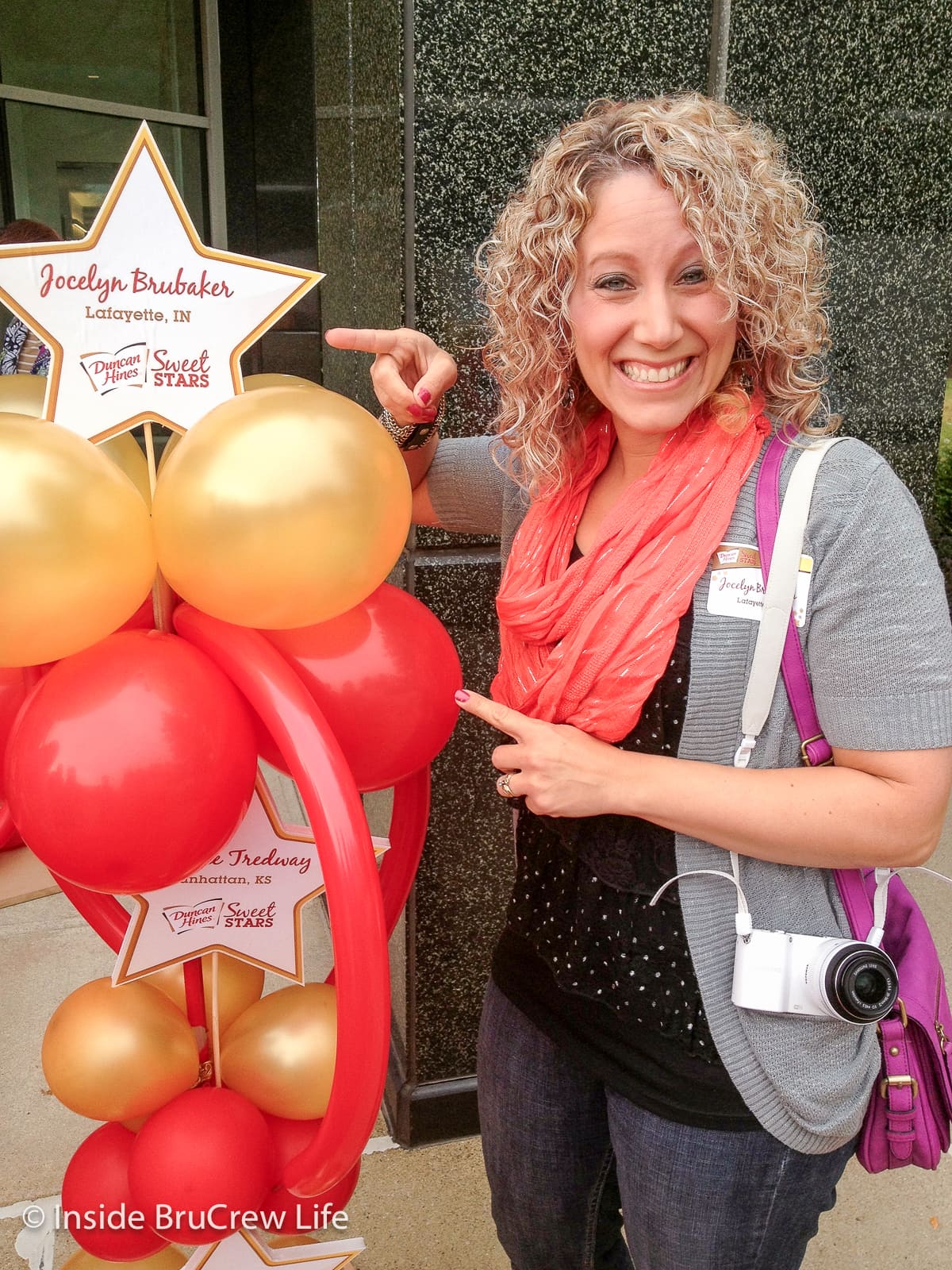 A picture of Jocelyn Brubaker with balloons at a Duncan Hines event.