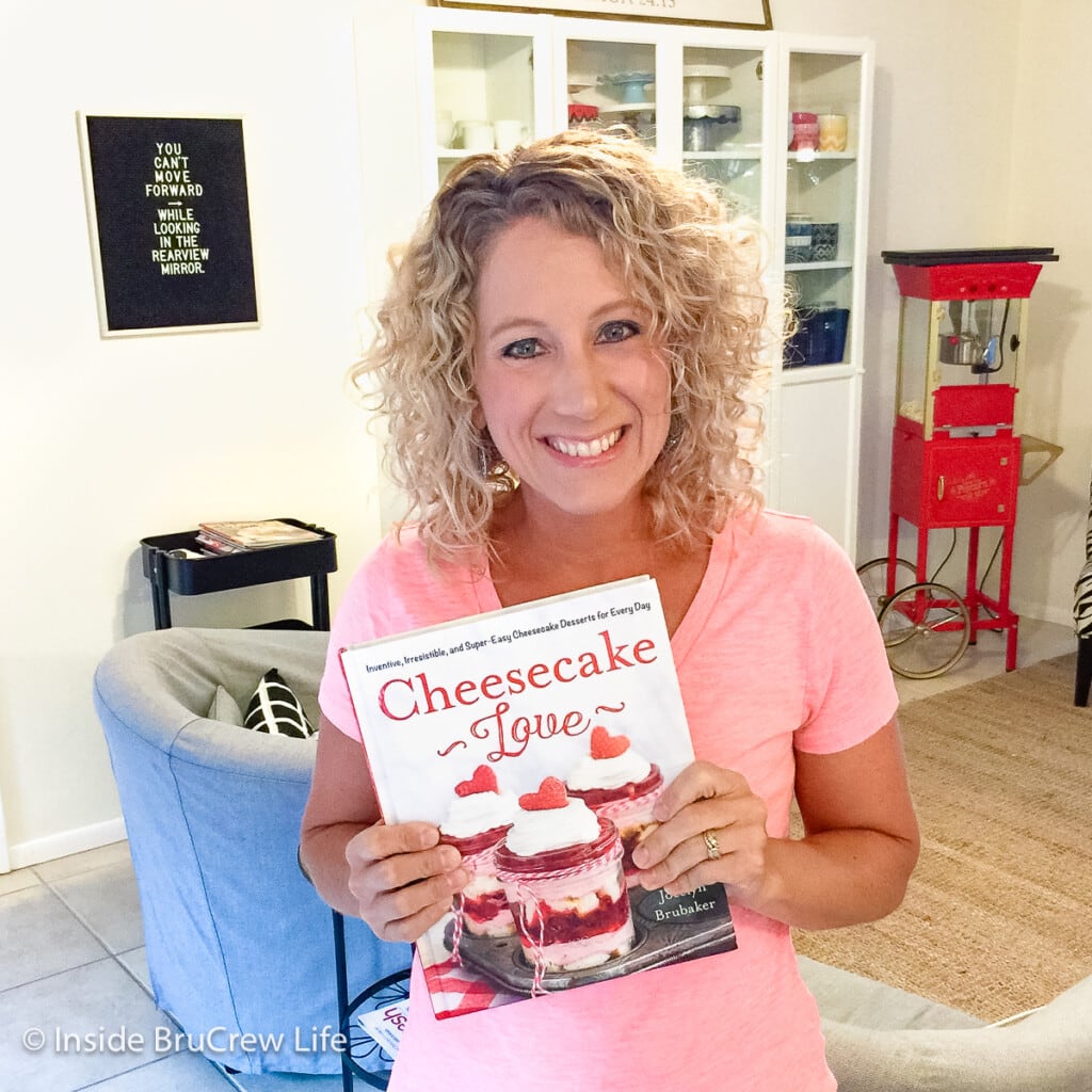 Jocelyn Brubaker holding up her cookbook.