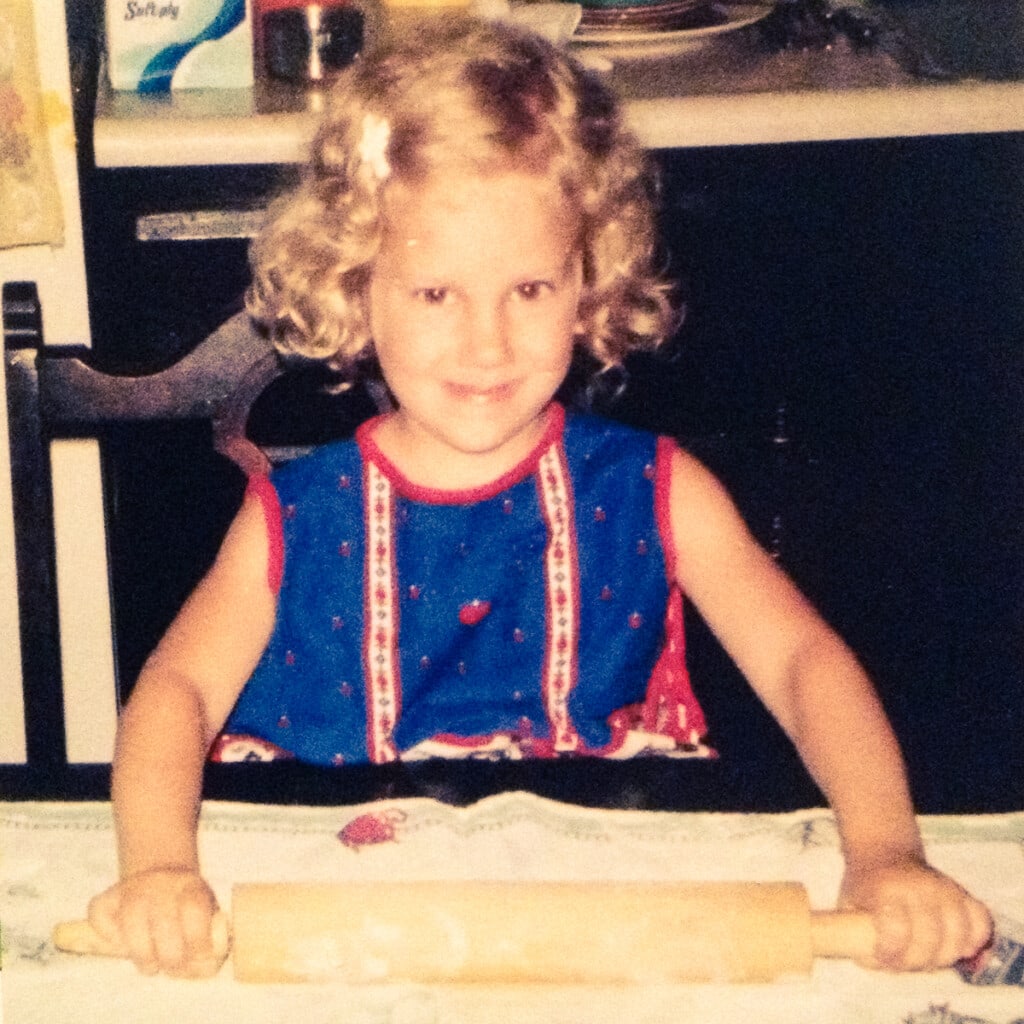 Jocelyn Brubaker baking a pie as a child.