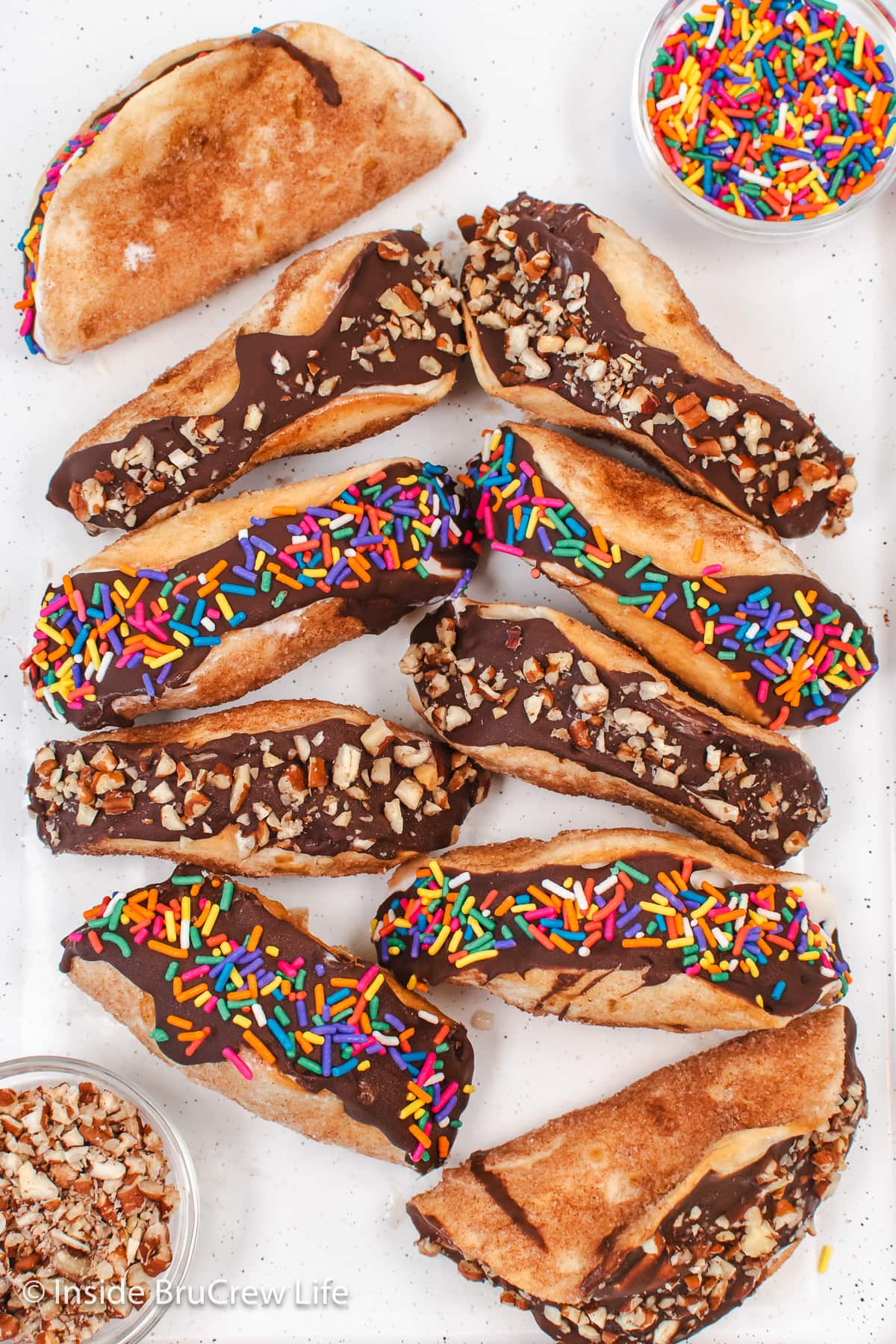 Cinnamon dessert tacos on a white tray.